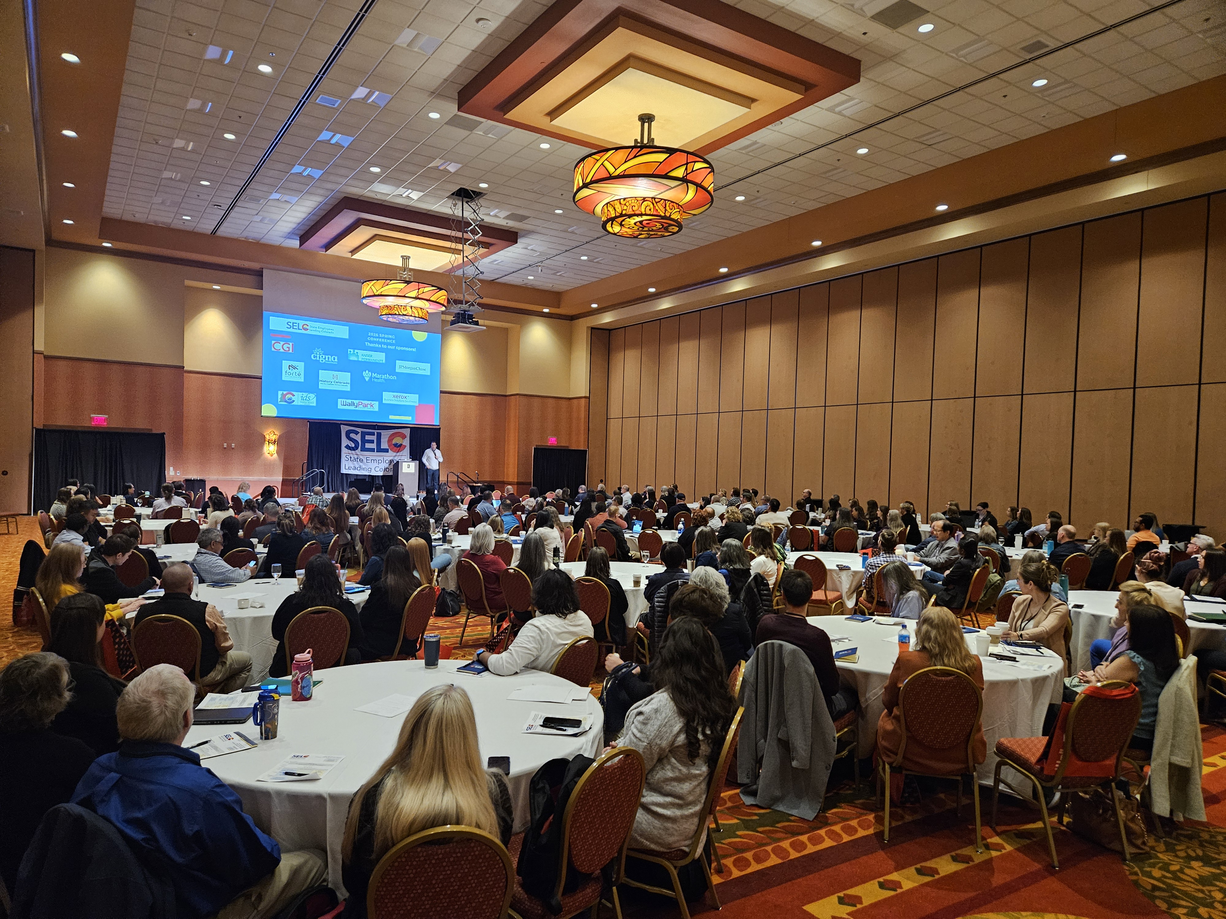 banquet room filled with tables and people